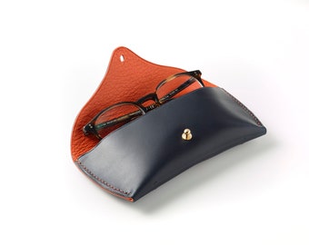 Glasses case made with vegetable tanned leather, lined in orange Chevre and hand stitched in linen thread.