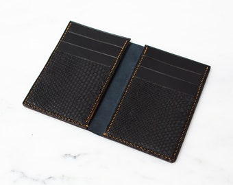 Mens 10 pocket wallet. Handmade from Vegetable tanned leather and hand-stitched with linen thread.