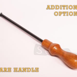 May include: A spare handle with a wooden grip and a black metal rod. The handle is a light brown color and has a smooth, polished finish. The text "ADDITIONAL OPTION" and "SPARE HANDLE" are visible.
