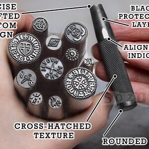 May include: A collection of metal stamps with various designs, including crosses and Celtic knots. The stamps have a cross-hatched texture and are held with a black handled tool with an alignment indicator. The text on the image says "Precise Crafted Custom Design".