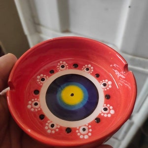 handmade cigarette ashtray with evil eye bead pattern