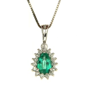 May include: A pear-shaped emerald gemstone pendant set in a silver chain. The emerald is surrounded by a halo of smaller diamonds.