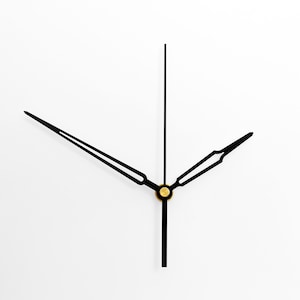 May include: Black clock hands with a gold center point against a white background.