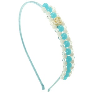 May include: A light blue headband with white and light blue beads and a white flower accent.