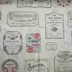 May include: A fabric featuring a repeating pattern of vintage perfume and toiletry labels in various shapes and sizes. The labels are in French, with floral and botanical illustrations, and a muted color palette of beige, red, and black.
