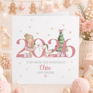 Personalised 2026 Christmas card for a great granddaughter, featuring a cute blonde ballerina holding a bunny beside a pink Christmas tree, rocking horse and presents, with gold stars, pink hearts and the name Elsie.