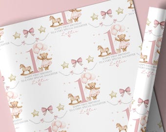 May include: White wrapping paper with a repeating pattern of pink teddy bears holding balloons, rocking horses, bows, stars, and the number 1. Text reads "Happy First Birthday To A Very Special Daughter Lattie."