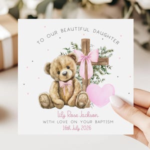 May include: A set of three ceramic mugs with a speckled, cream-colored glaze. Each mug features a different hand-painted floral design in shades of blue, green, and yellow. The mugs have a simple, modern shape.