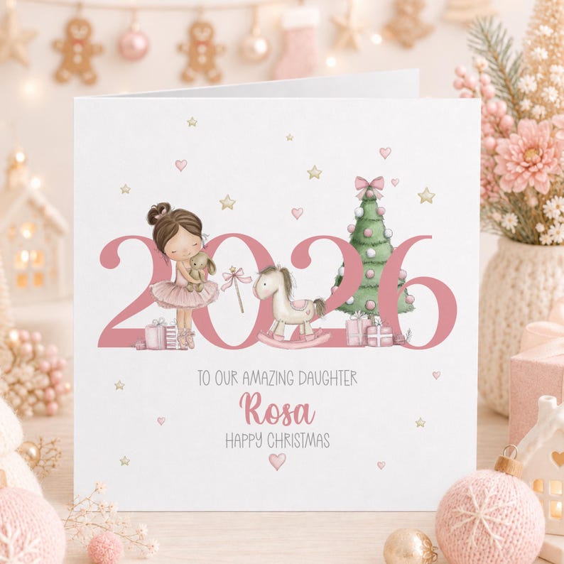 Personalised 2026 Christmas card for a great granddaughter, featuring a cute brunette ballerina holding a bunny beside a pink Christmas tree, rocking horse and presents, with gold stars, pink hearts and the name Rosa.