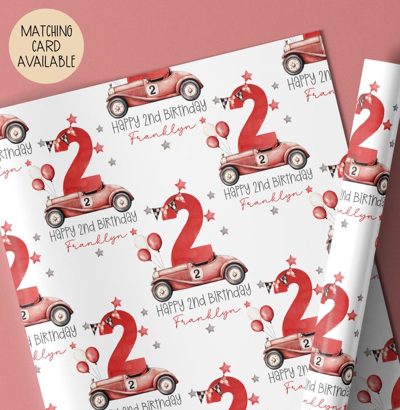 Luxury white personalized 1st birthday race car themed wrapping paper, featuring a watercolor red racing car with the number 1 on the side of it & a large number 1 with bunting & balloons and the wording 'Happy 1st Birthday' personalised with the child's name.