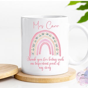 May include: White ceramic mug with a pink and peach rainbow design and floral accents. The text "Mrs. Carr" and "Thank you for being such an important part of my story" is printed on the mug.