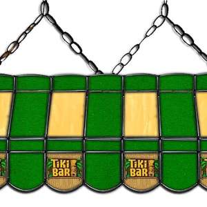 May include: A green and yellow stained glass pool table light fixture with the words "Tiki Bar" repeated on each of the six panels. The light fixture is suspended from a chain.