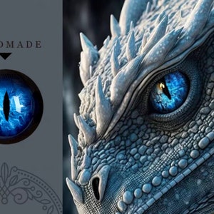 May include: A close-up of a dragon's eye with a bright blue iris and a black pupil. The eye is set against a backdrop of a dragon's textured, gray-blue scales. The word "HANDMADE" is above a smaller image of the eye.