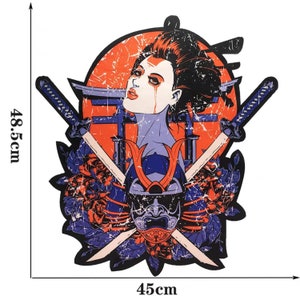 May include: A graphic illustration of a geisha with crossed katanas, a samurai helmet, and floral elements. The artwork is 45cm wide and 48.5cm tall, featuring a distressed, vintage aesthetic with red, orange, blue, and purple hues.