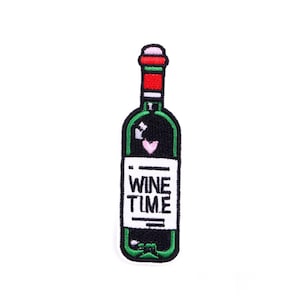 May include: Embroidered patch in the shape of a wine bottle. The bottle is black with a green outline and a red top. The patch has the words "WINE TIME" in white, and a pink heart.