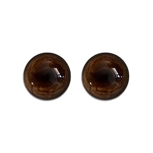 Op de afbeelding: Twee bruine plastic veiligheidsogen voor knutselen. De ogen hebben een donkerbruine iris en een zwarte pupil.