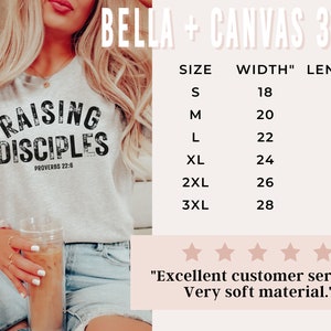 May include: A gray Bella + Canvas 3001 t-shirt with the text "Raising Disciples" and "Proverbs 22:6" printed on it. The t-shirt is being worn by a person. A size chart is included with the text "SIZE", "WIDTH"