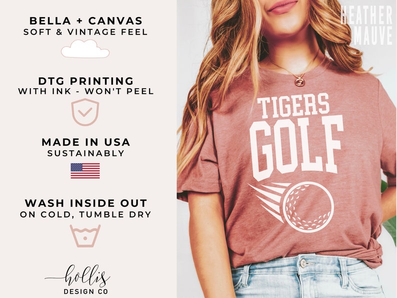 May include: A heather mauve t-shirt featuring the text "TIGERS GOLF" in white. A white golf ball with a white swoosh is positioned below the text. The shirt is crafted from Bella + Canvas fabric, known for its soft feel and vintage aesthetic. The shirt is printed using DTG printing, ensuring the ink won't peel. The shirt is sustainably made in the USA.