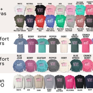 May include: A chart displaying various t-shirt colours and styles for Bella+Canvas 3001, Comfort Colors 1717, Comfort Colors 6014, and Gildan 18000. The chart features a range of colours, including white, black, pink, ash, lilac, sea green, charity pink, mustard, heather military green, navy, red, true royal, kelly, athletic heather, heather mauve, dark grey heather, peach, blue jean, berry, seafoam, pepper, ivory, blue spruce, crunch berry, violet, and forest green.