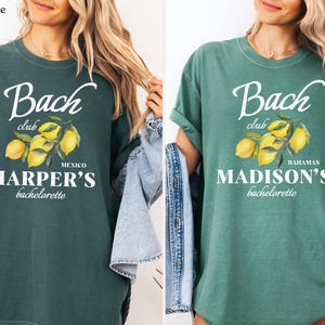 May include: Two t-shirts, one blue spruce and one light green, feature the text "Bach Club" with a lemon illustration. The blue spruce shirt says "Mexico HARPER'S bachelorette", while the light green shirt says "Bahamas MADISON'S bachelorette".