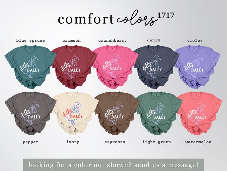 May include: A selection of Comfort Colors t-shirts in shades like blue spruce, crimson, and violet. Each tee displays a duck graphic with the words "dilly dally". The text "comfort colors" and "1717" are at the top.