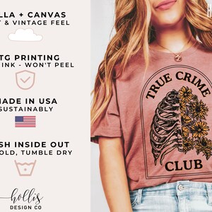 May include: A heather mauve t-shirt with a graphic of a ribcage with flowers and the text "True Crime Club".