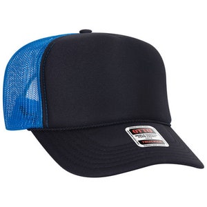 May include: Black trucker hat with a blue mesh back. The hat has a structured front panel and a curved brim. A small tag is visible on the brim.