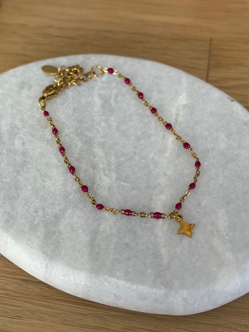 Thin minimalist bracelet in gold stainless steel with small star image 10