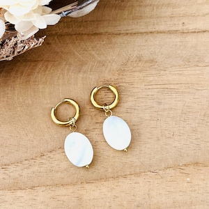 Stainless steel hoop earrings with oval mother-of-pearl pendant