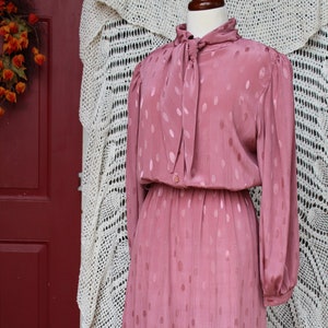 Ladies 80&#39;s Mauve Puffed Sleeve, Elastic Waist, Bow Tie Neck, Button Closure, Long Sleeve, Mid Length Classy Dress