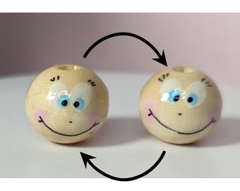 hand-painted wooden beads with two faces, both happy