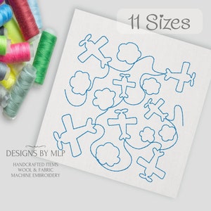 May include: Blue outline embroidery design of airplanes flying through clouds. The design is available in 11 sizes. The text "Designs by MLP" is in the lower left corner. The text "Handcrafted Items Wool & Fabric Machine Embroidery" is below the text "Designs by MLP".