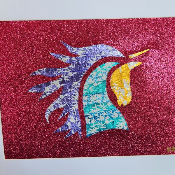 Glittercorn - A fun and sparkly Unicorn made with Lindt Truffle wrappers an 11x14 frame. Red silhouette with Teal and Purple Unicorn