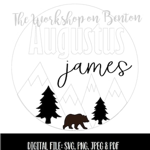 May include: A white circle with the text "The workshop on Benton" and "Augustus james" in black. The circle contains a black bear, two black pine trees, and white mountains.