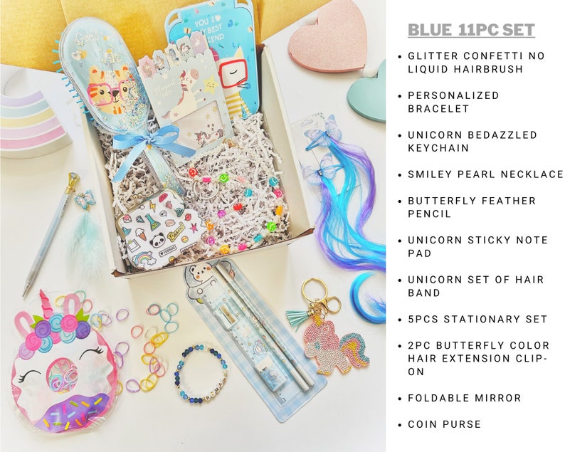 May include: A blue 11-piece gift set featuring a glitter confetti hairbrush, personalised bracelet, unicorn keychain, smiley pearl necklace, butterfly feather pencil, sticky note pad, hair band, stationery set, butterfly hair clips, mirror, and coin purse.