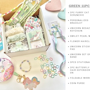 May include: A green 11-piece gift set containing a cat ear scrunchie, a personalised bracelet, a unicorn keychain, a smiley pearl necklace, a flower hairclip, a sticky note pad, a hair band set, a stationary set, butterfly hair extensions, a foldable mirror, and a coin purse.