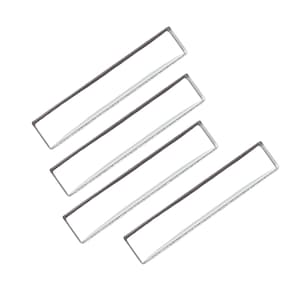 May include: Four silver-colored rectangular frames, stacked in a staggered pattern, against a white background.