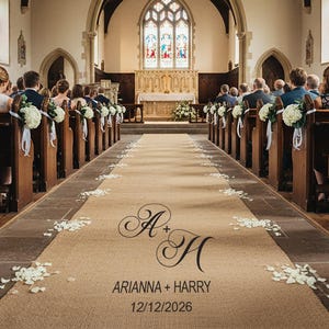 May include: Interior view of a church during a wedding ceremony. Guests are seated in wooden pews on either side of a central aisle. The aisle runner is decorated with the couple's initials, names, and wedding date. Floral arrangements adorn the pews.