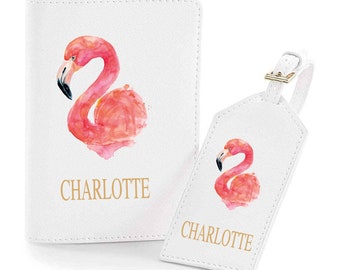 May include: White passport holder and luggage tag set with a pink flamingo illustration and the name Charlotte printed in gold.