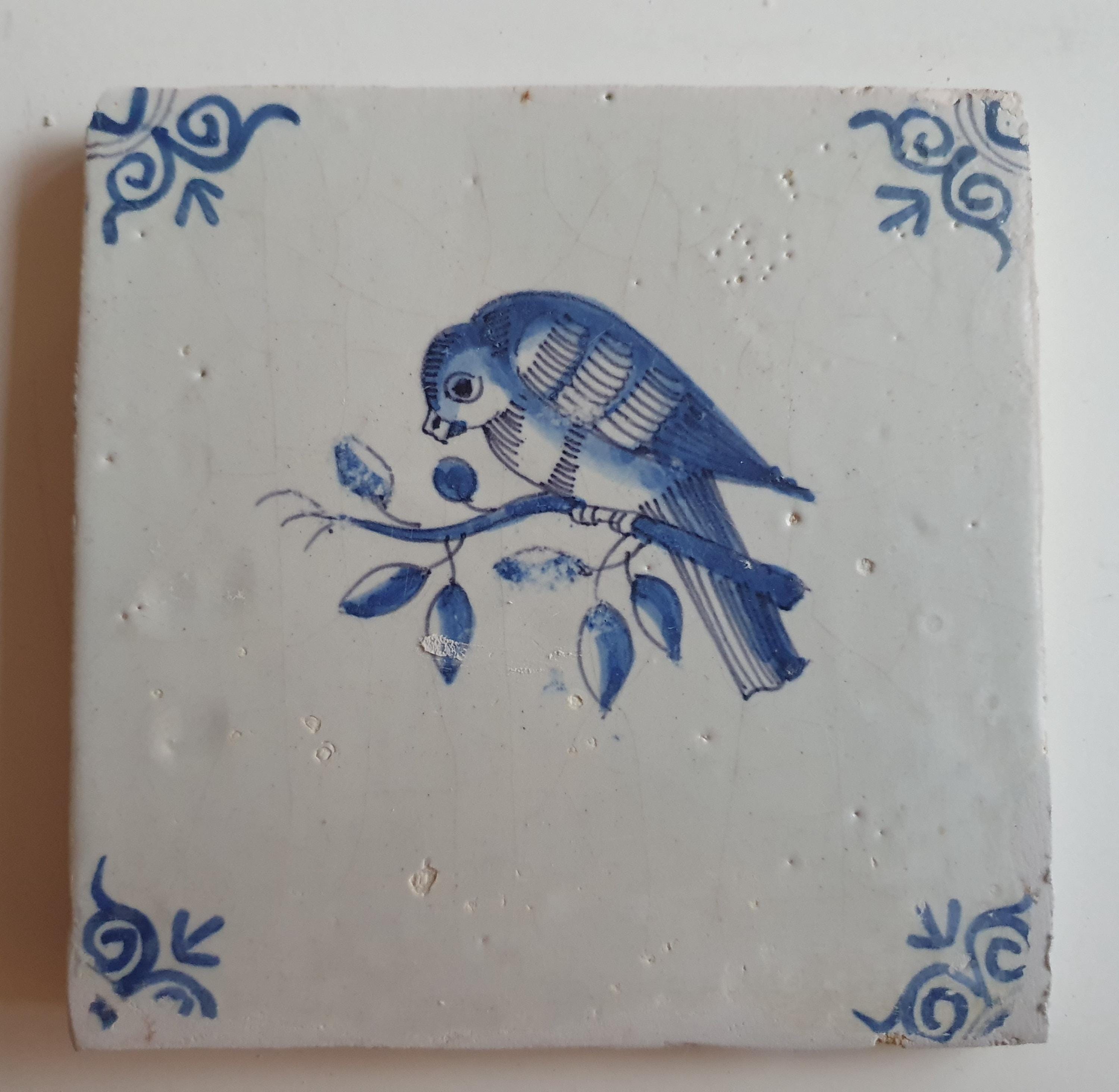 17th century Antique Dutch Tile bird with oxhead corner motive delft blue holland tile