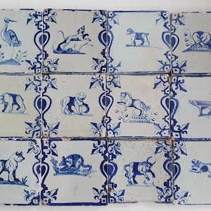 12 x Antique Dutch Tiles with a animals decorated with baluster sides and french lily corner motifs - Dated 1640, Dutch Delft