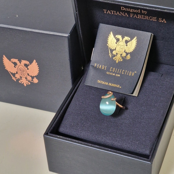 Tatiana Fabergé, olga swirl ring, boxed, coa, celestial stone Egg ring 22KT roseg. gilded 925 silver mysterious gray-blue cabochon stone