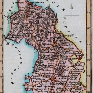 May include: An antique map of Cambridgeshire, England, with a scale of miles and a key showing the surrounding counties. The map is printed on paper and has a faded, vintage look. The map shows the location of towns, rivers, and other geographical features.