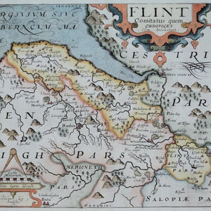 May include: An antique map of Flint, Wales, from the 17th century. The map is hand-drawn and features detailed illustrations of the surrounding countryside, including rivers, mountains, and towns. The map is titled "Flint Comitatus quem Ordouices olim Incoluerunt" which translates to "Flint County, which the Ordovices once inhabited."