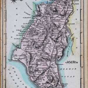 May include: An antique map of Kent, England, showing towns, rivers, and roads in detail. The map is printed in shades of blue, green, pink, and brown, with a key explaining the symbols used. The map is titled "Kent" and includes the text "London Published by J. Wallis Engraver 77. Berwick Str. Sohe."