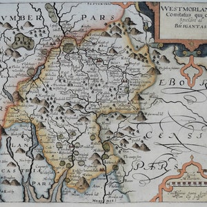 May include: An antique map of Westmorland, England, with the title "Westmorland Comitatus qui olim Spectant ad BRIGANTAS." The map is hand-drawn and features a detailed depiction of the region's geography, including rivers, mountains, and towns. The map is surrounded by a decorative border.