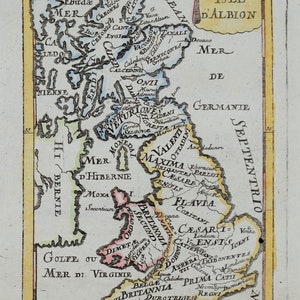 May include: A vintage map of the Isle of Albion, showing the different regions and tribes of Britain. The map is in a light blue, yellow, and pink colour scheme. The text on the map is in Latin.