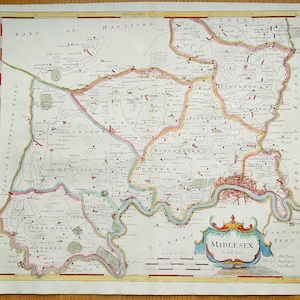 May include: An antique map of Middlesex, England, printed in black, red, blue, and green ink on paper. The map shows the county's boundaries, rivers, towns, and villages. The title "Middlesex" is displayed in a decorative banner at the bottom center of the map.