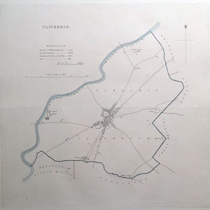 May include: A black and white map of Clitheroe, England, showing the town's boundaries, roads, and buildings. The map includes a key with a reference to the scale of the map.