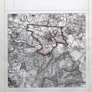 May include: A black and white map of Hereford, England, showing the proposed parliamentary boundary, parliamentary boundary, municipal boundary, and parish and township boundaries. The map includes the text "HEREFORD" at the top and "REFERENCE" at the bottom.